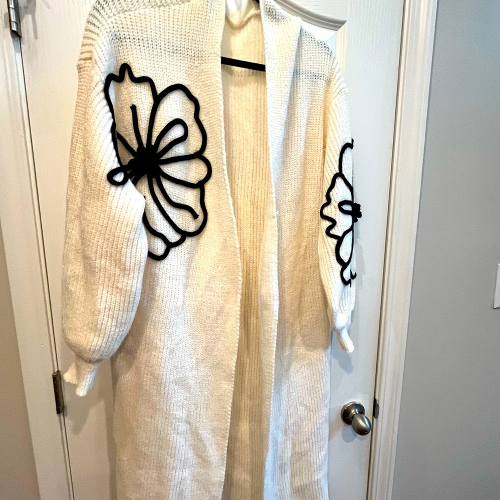 Long sweater cardigan with black flowers. Size large. Worn once.